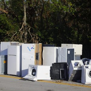 IMage of old appliances left outside for trash pickup